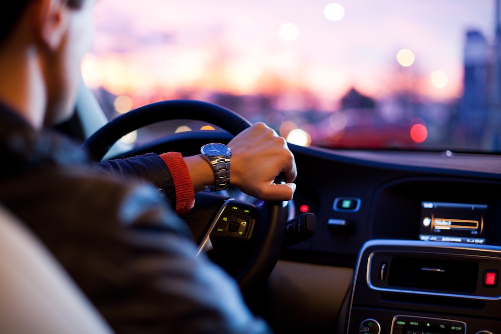 Driver using a phone mounted beside the steering wheel